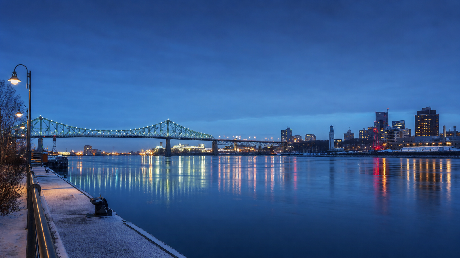 The Montréal waterfront and Jacques-Cartier Bridge reflected at blue hour